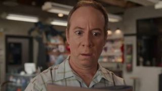 Stuart looks horrified at a piece of paper