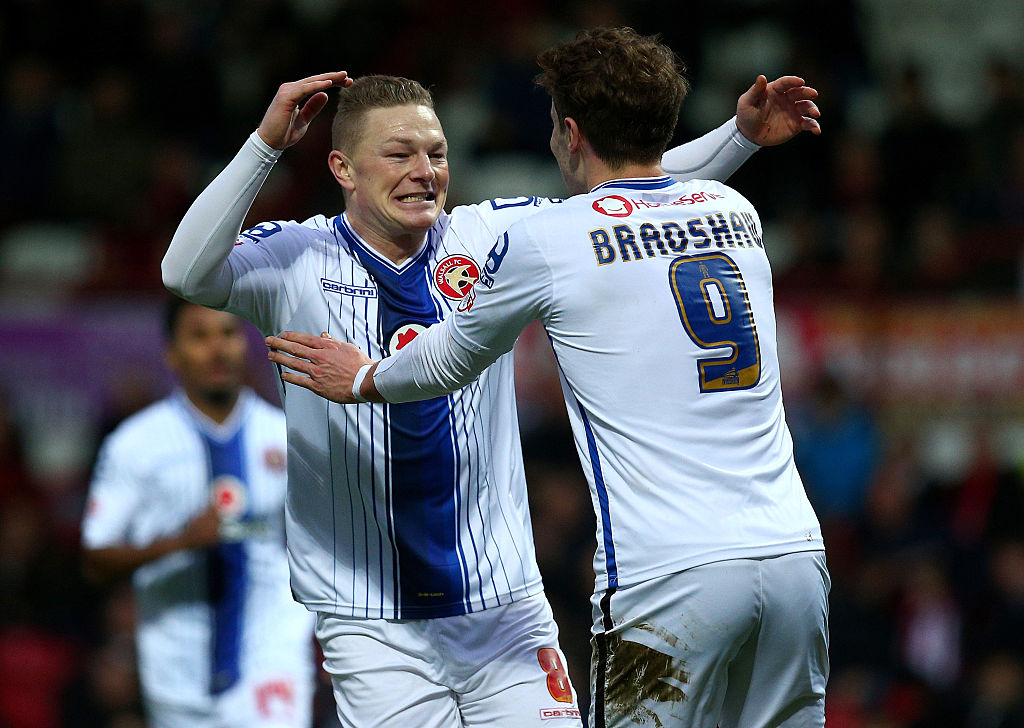 Sam Mantom of Walsall celebrates with team mates after scoring the first goal of the game during the FA Cup Third Round match between Brentford v Walsall at Griffin Park on January 09, 2016 in London, England.