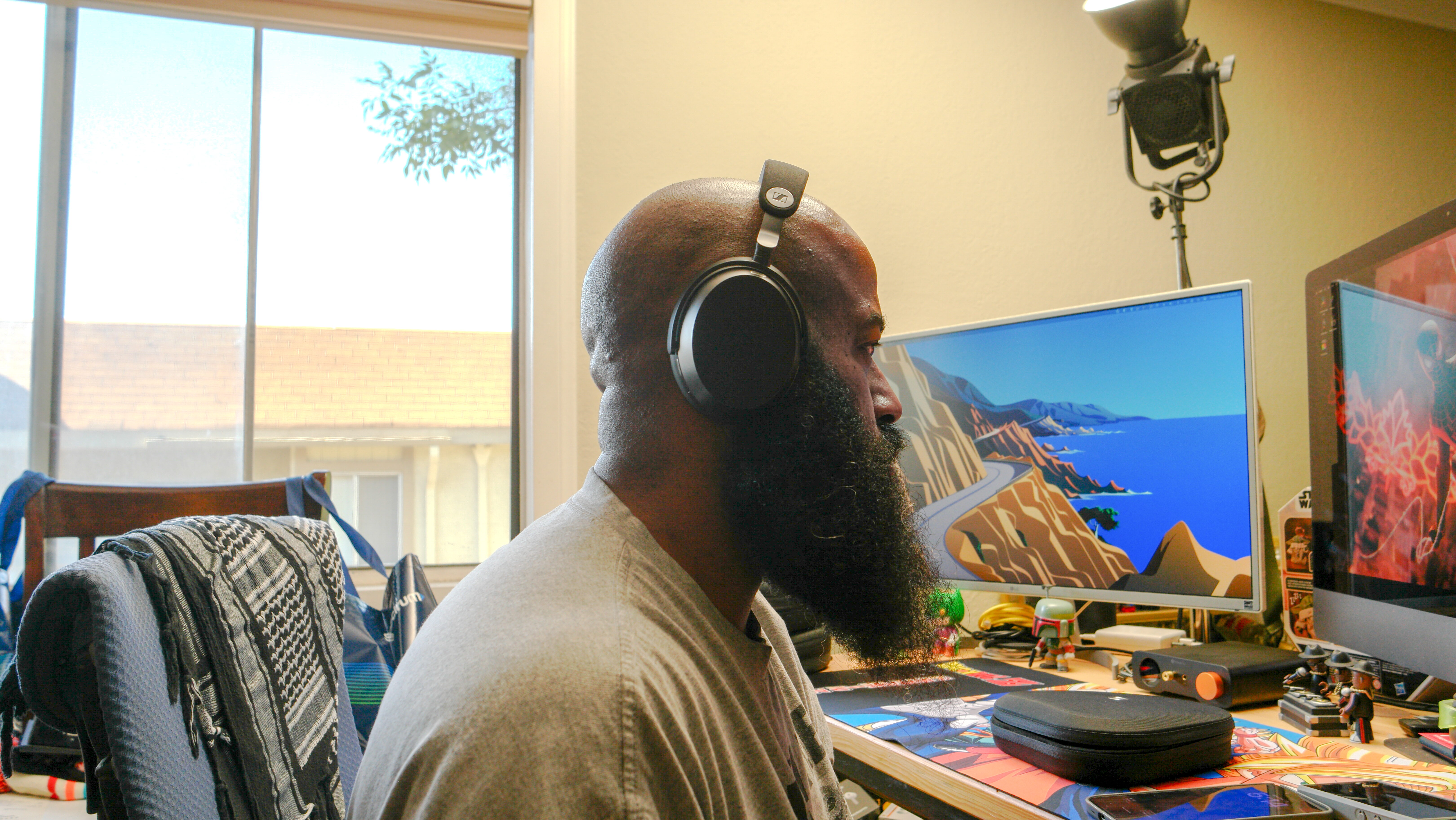 Sennheiser Momentum 5 headphones being worn by the reviewer