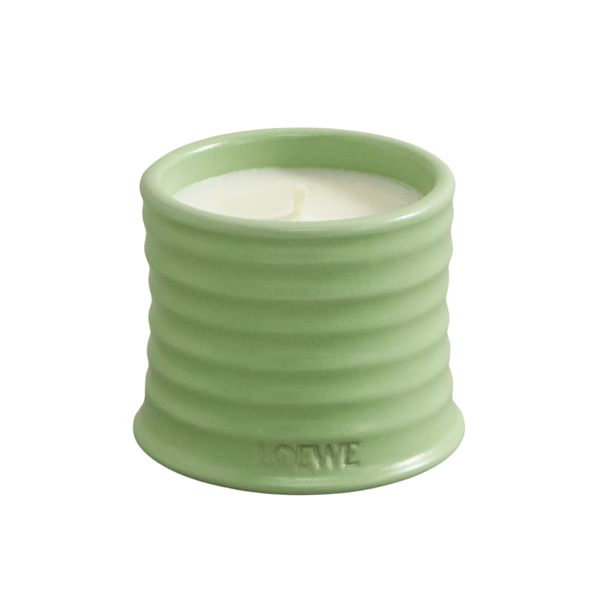 green candle with ribbed texture on the vessel