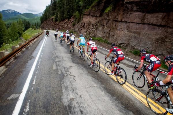 Mountains loom in the distance for the peloton.