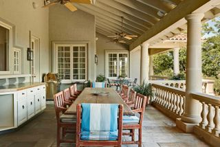 covered porch with dining table
