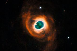 Planetary nebulas like Kohoutek 4-55 shown here in a photo from the Hubble Space Telescope provide the raw material for other stars and planets to form.