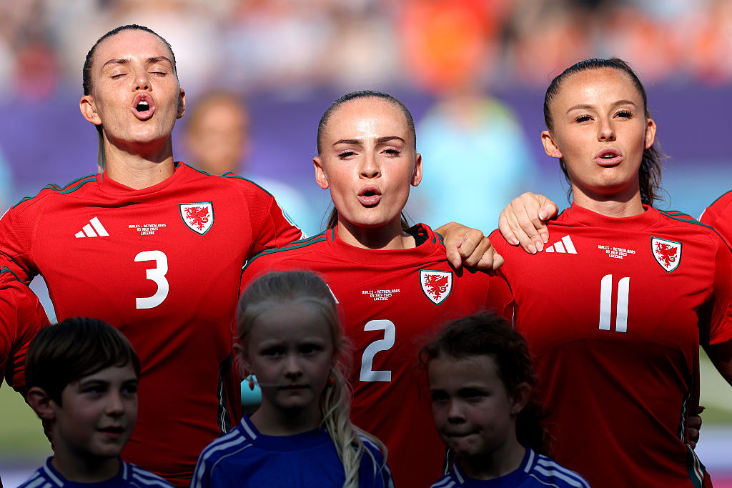 Wales women line-up before their opening Euro 2025 game against the Netherlands