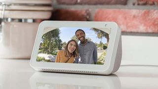 Ring camera feed of a couple standing at the door, being displayed on an Alexa