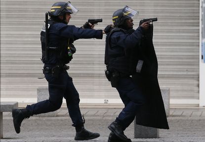 French police take up positions.