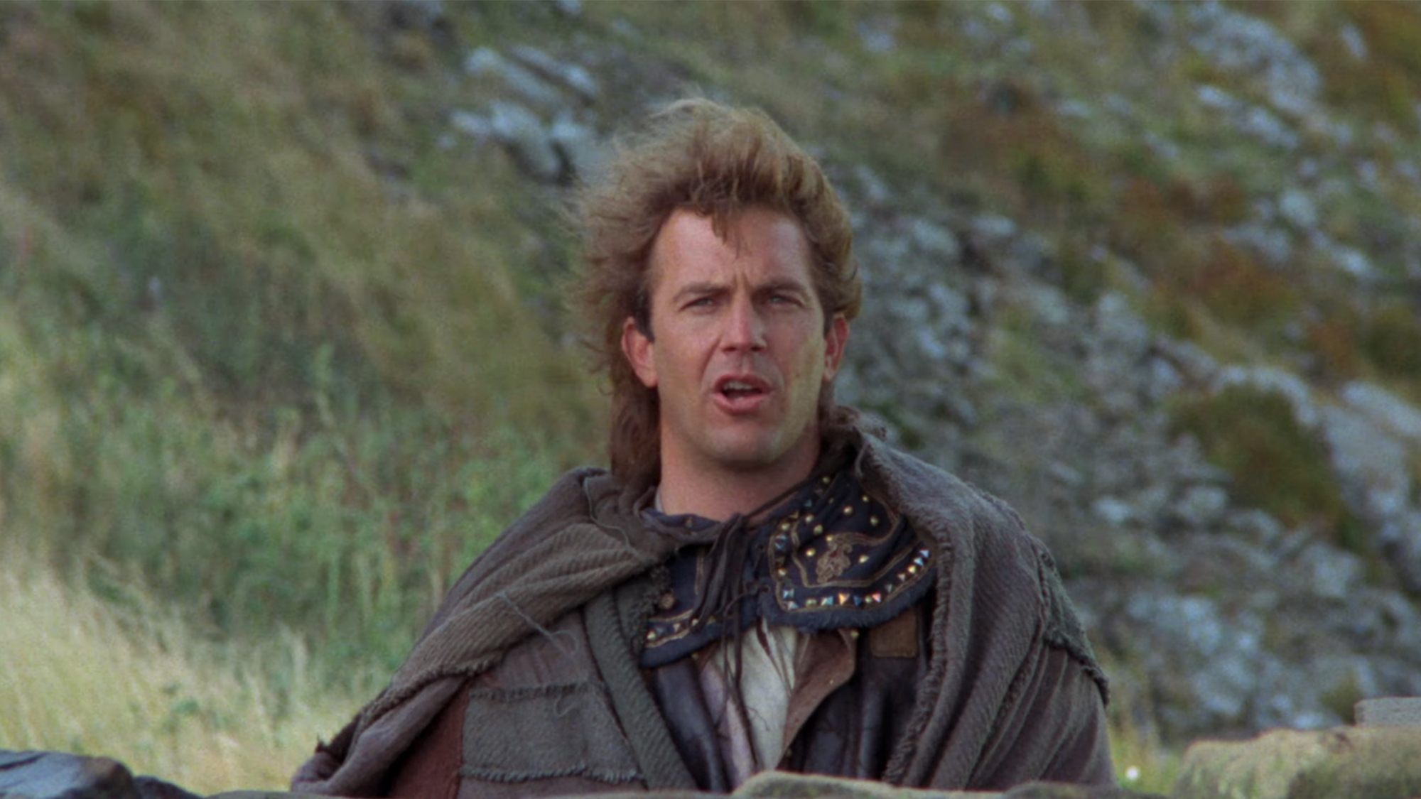 Kevin Costner as Robin Hood looking at behind the camera