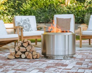 Best fire pits lifestyle image of fire pit lit in garden