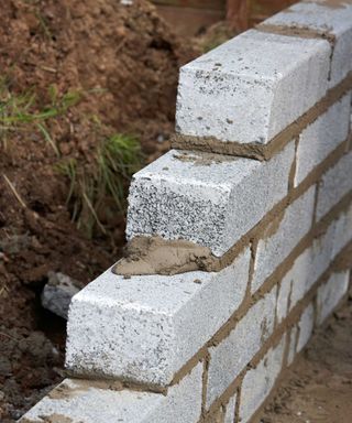 How to build a garden wall: tips for timber, brick, and more