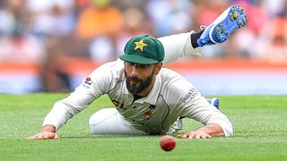 Pakistan captain Shan Masood diving in the field