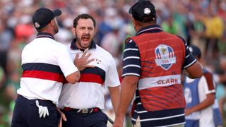 Patrick Cantlay screams with his caddie