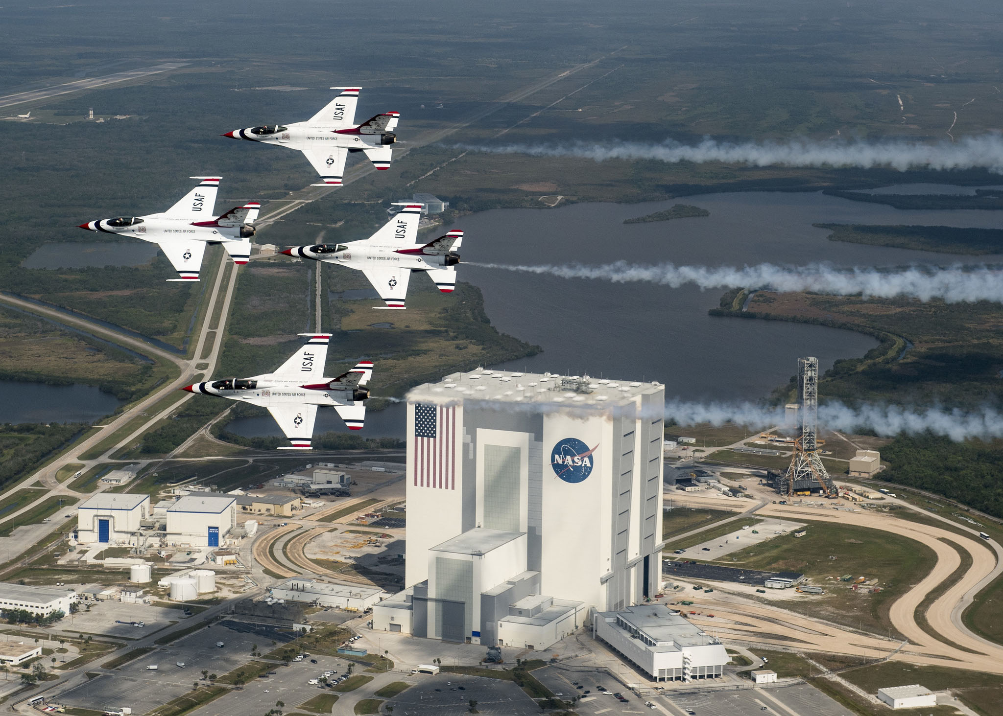 President Donald Trump wants a new Space Force branch of the U.S. military, but it reopens an old argument about military uses in space. Here, the U.S. Air Force Thunderbirds fly over NASA&#039;s Kennedy Space Center in Florida with retired NASA astronaut and 