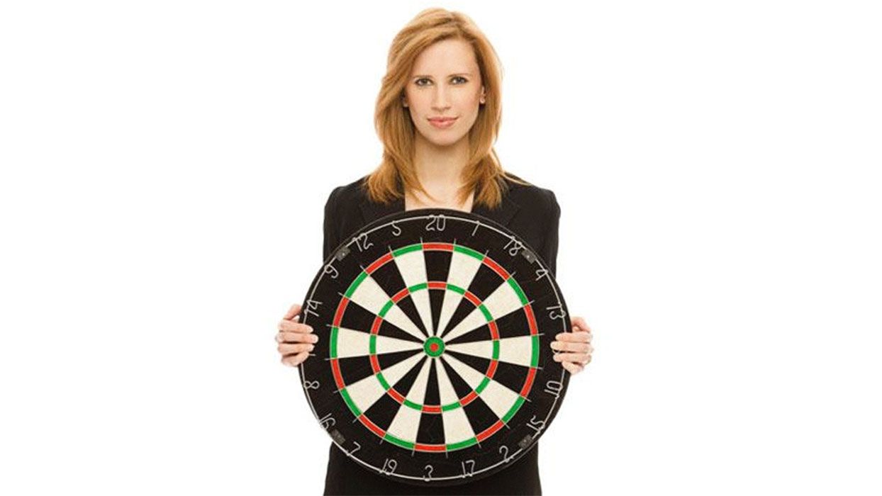 Woman holding dart board