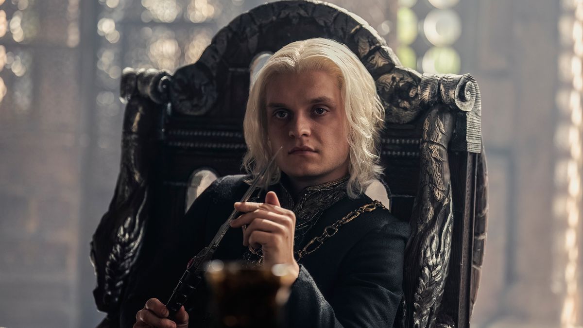 Aegon II (Tom Glynn-Carney) sitting in a chair in the Small Council room in &quot;House of the Dragon&quot; season 2