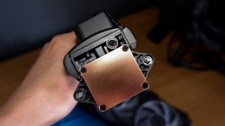 An Arctic Liquid Freezer III Pro liquid cooler set-up on a test bench with the RGB enabled.