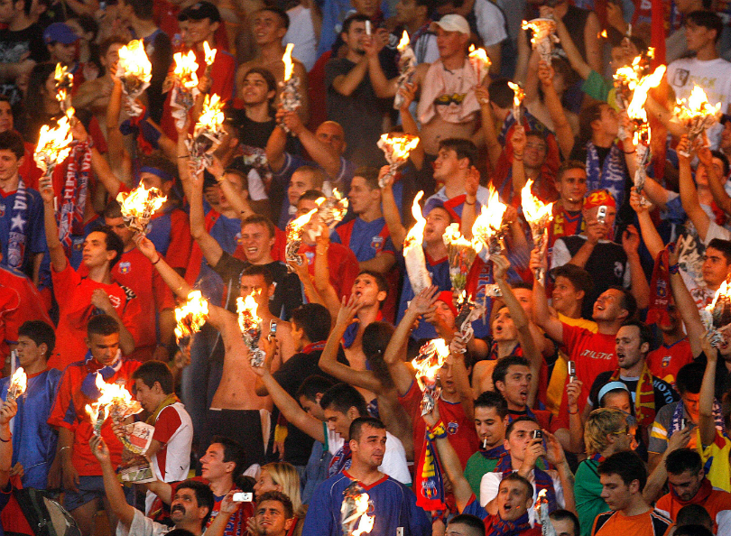 The fans from Steaua Bucuresti fight with the police in the stands News  Photo - Getty Images