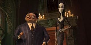 Oscar Isaac and Charlize in The Addams Family