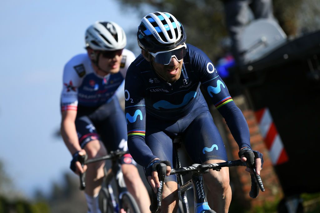 SIENA ITALY MARCH 05 Alejandro Valverde Belmonte of Spain and Movistar Team competes ahead of Kasper Asgreen of Denmark and Team QuickStep Alpha Vinyl during the Eroica 16th Strade Bianche 2022 Mens Elite a 184km one day race from Siena to Siena Piazza del Campo 321m StradeBianche WorldTour on March 05 2022 in Siena Italy Photo by Tim de WaeleGetty Images