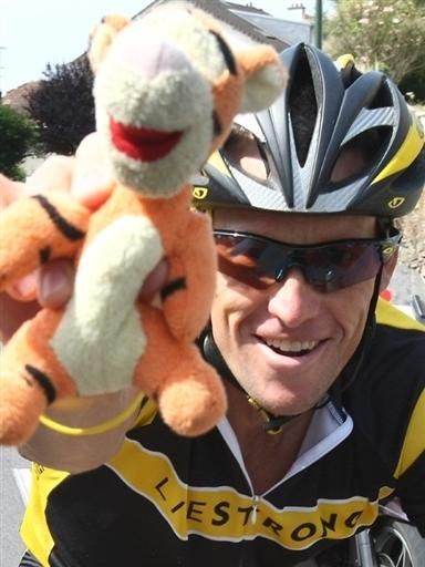 Lance Armstrong (Astana) has some fun with the cameras during the rest day. We're not sure how Tiger fits into the equation.