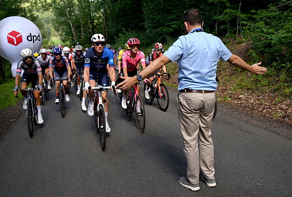WALBRZYCH, POLAND - AUGUST 06: The peloton stopped due to the crash in the peloton during the 82nd Tour de Pologne 2025, Stage 3 a 159.3km stage from Walbrzych to Walbrzych / #UCIWT / on August 06, 2025 in Walbrzych, Poland. (Photo by Luc Claessen/Getty Images)