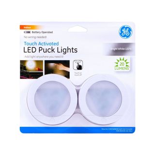 Two white puck LED lights