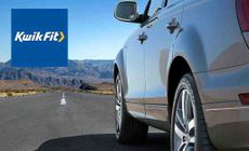 kwikfit logo placed over an image of a low angle shoot of a car driving down a long open road with mountain in the back