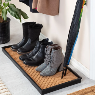 a little mat to sit shoes on in an entryway or mudroom