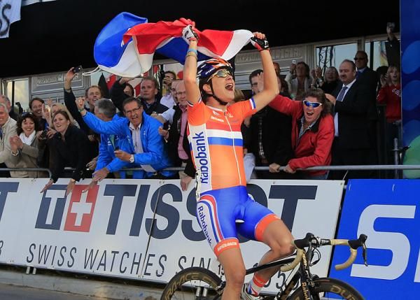 Marianne Vos (Netherlands) had enough time to grab a specator's flag on the finishing straight to fly across the finish line.