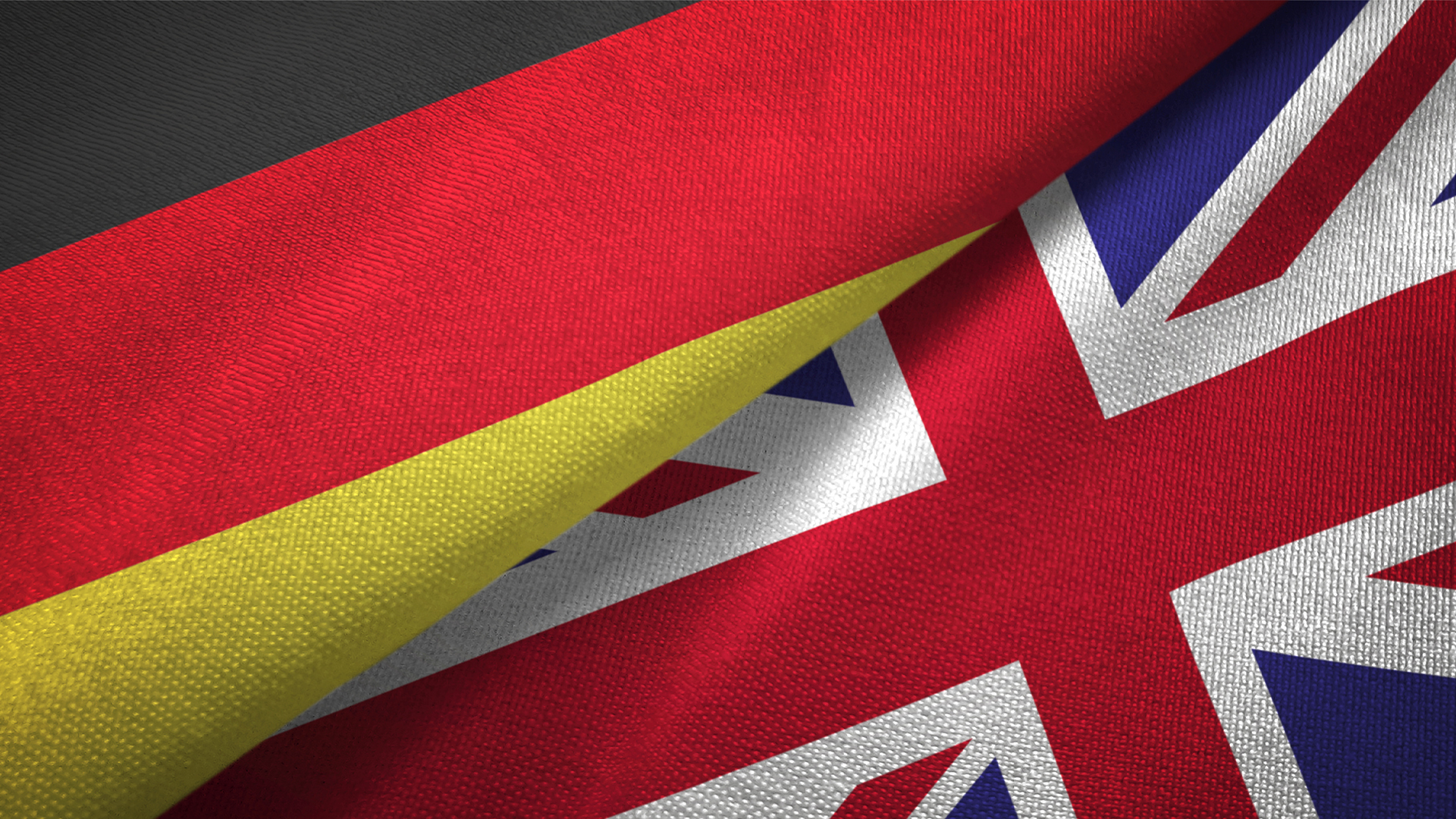 Flags of the United Kingdom and Germany folded and pictured side by side.