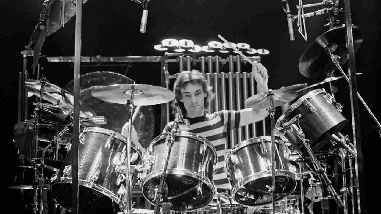 Rush&amp;rsquo;s Neil Peart sitting behind a drumkit in 1980