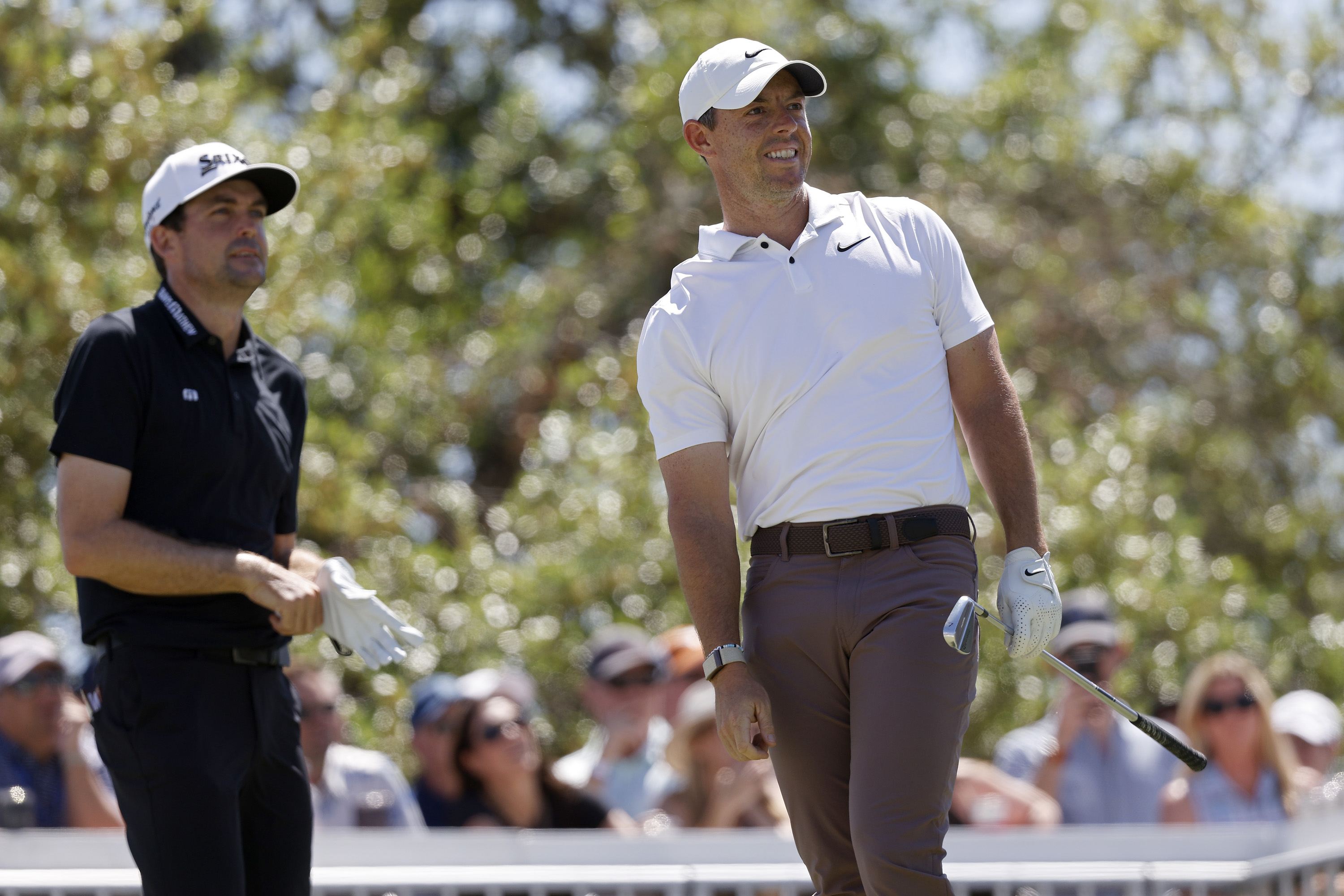 Keegan Bradley watches Rory McIlroy's tee shot