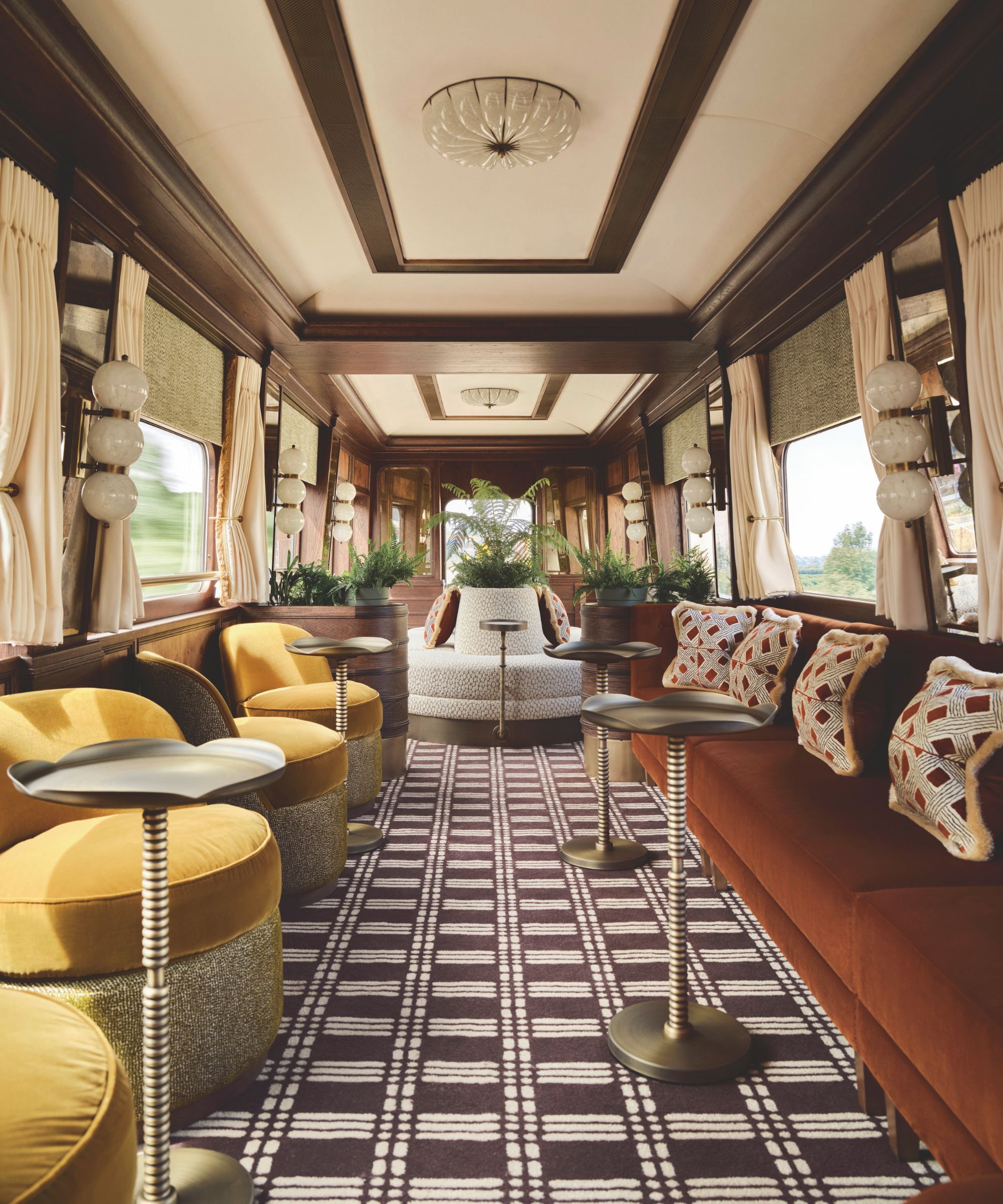 A retro inspired bar design with chequered carpet and yellow and red velvet seating