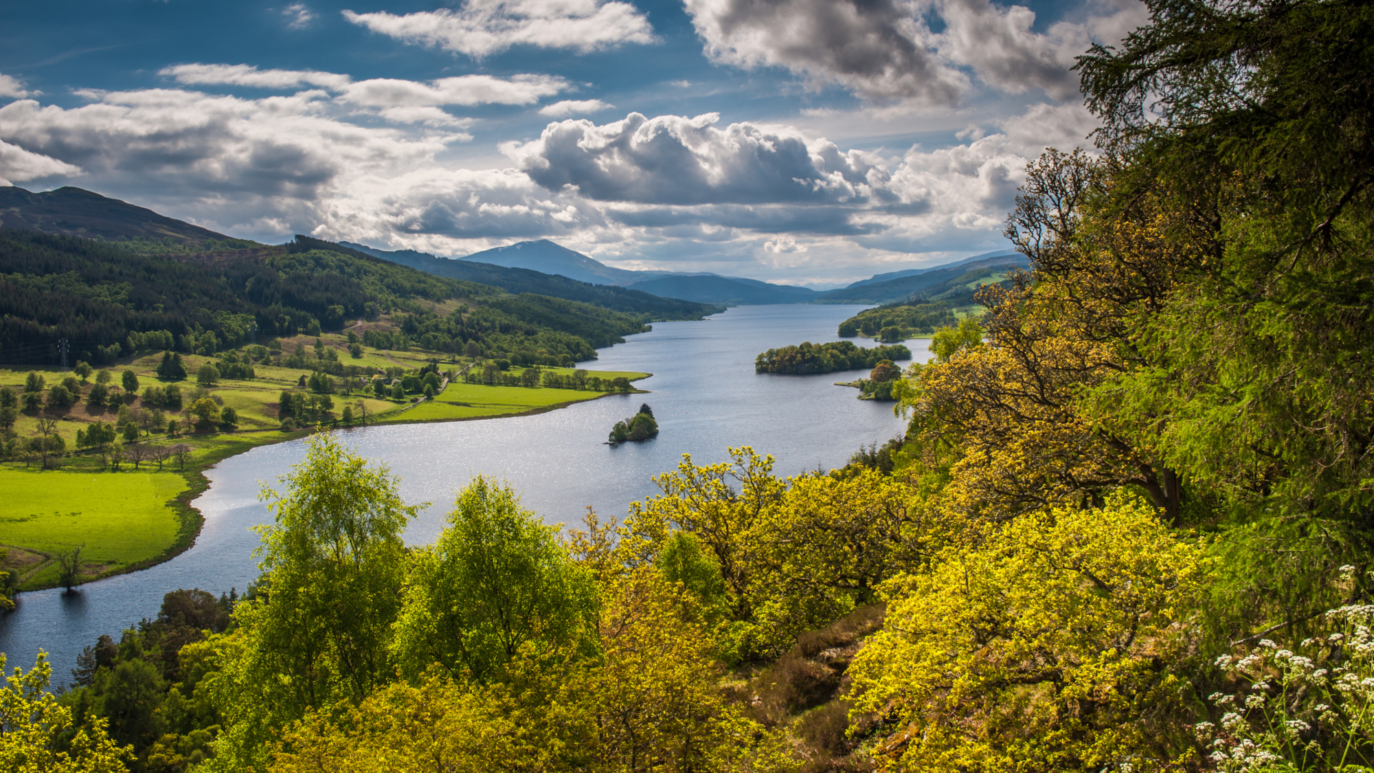 View over trees, Loch Tummel and distant mountains, from Queen's View, Perthshire