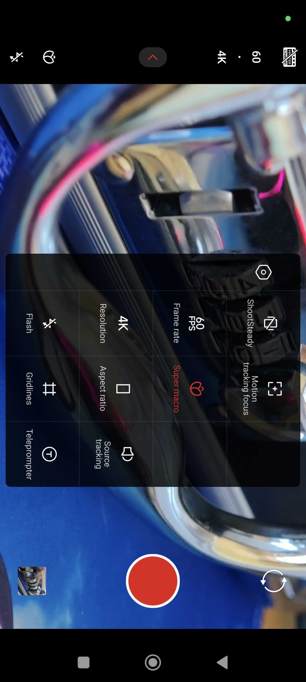 A liquid silver Xiaomi 15 on a detailed blue background