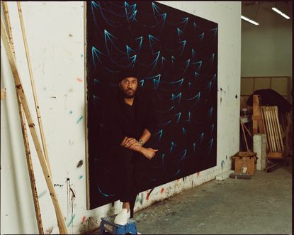 Rashid Johnson stands in front of his work Seascape Painting ‘Angola’, 2022, oil on linen