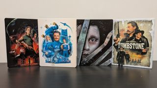4K Blu-ray collection of disney titles featuring tombstone, fantastic four first steps, alien romulus and edward scissorhands steelbook cases