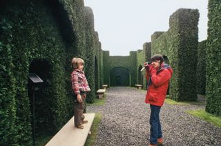 A deleted shot of Wendy Torrance taking Polaroids of Danny in the center of the hedge maze
