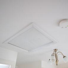 Loft hatch on a white painted ceiling
