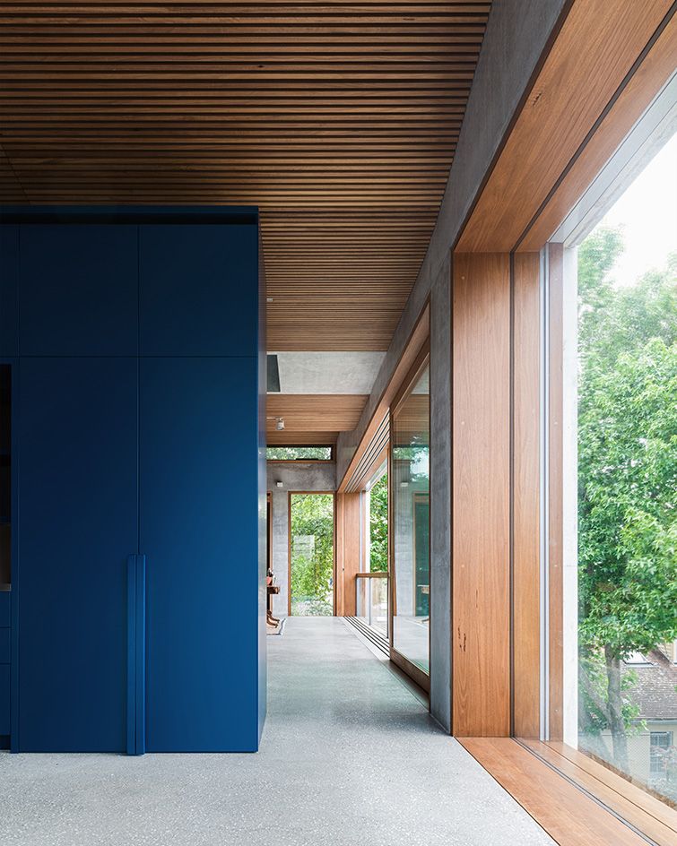 Treetops House blue wall and glazing and views