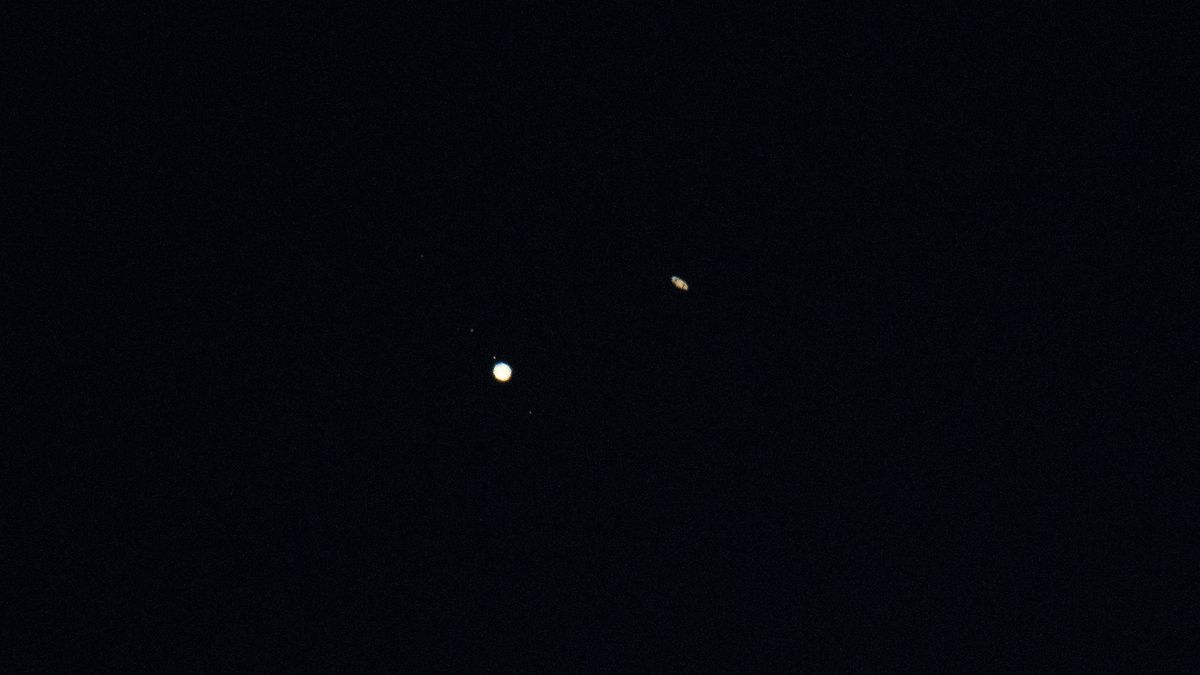 Jupiter (left) and Saturn (right) are seen after sunset above Jordan Lake during the "great conjunction" on Dec. 21, 2020, near Chapel Hill, North Carolina.