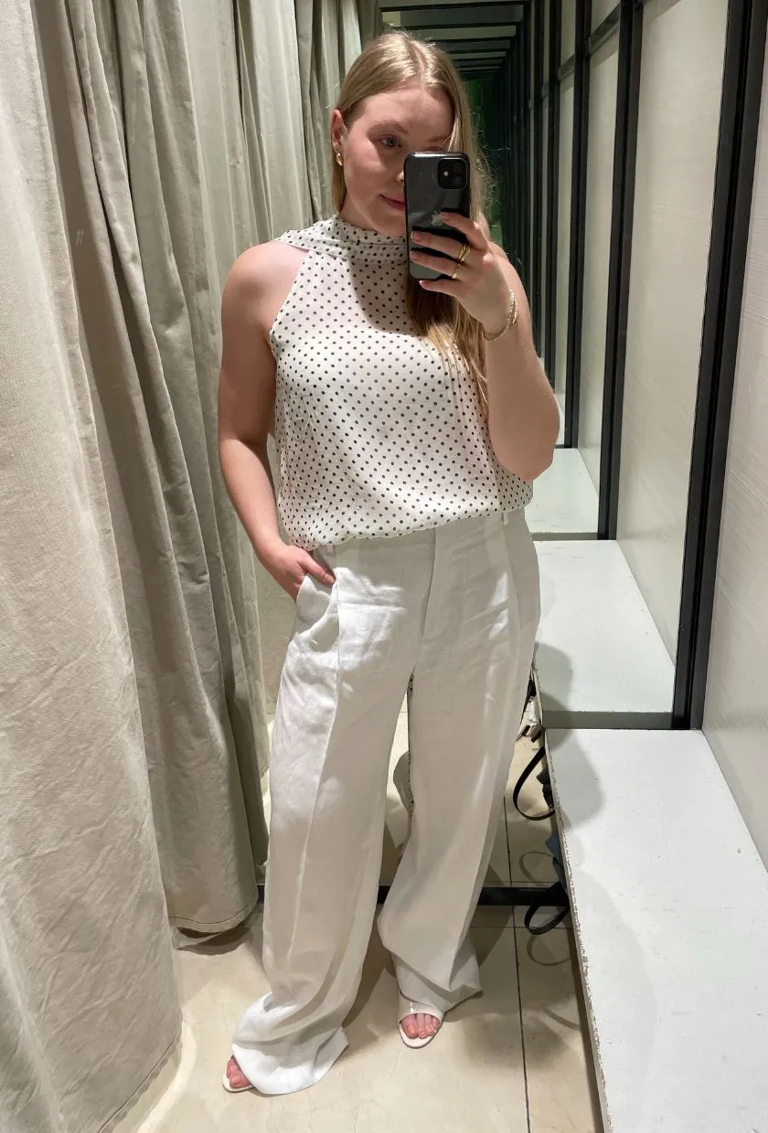 Florrie wears tailored linen trousers from Zara