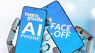 Two robotic hands holding two phones, with the text "Tom's Guide AI Phone Face-off"