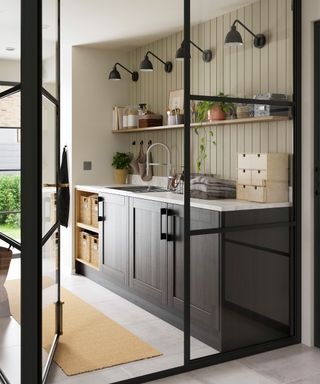 black crittal style doors leading into kitchen area