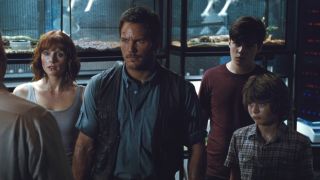 The hero cast stand together in a genetics lab in Jurassic World.