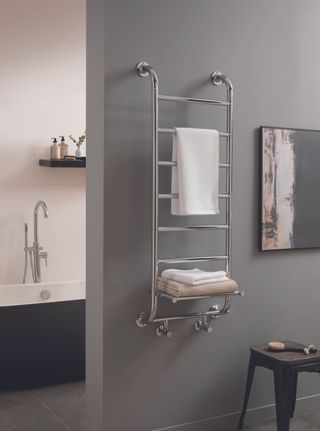 Grey, white and black bathroom with silver rail-shelf