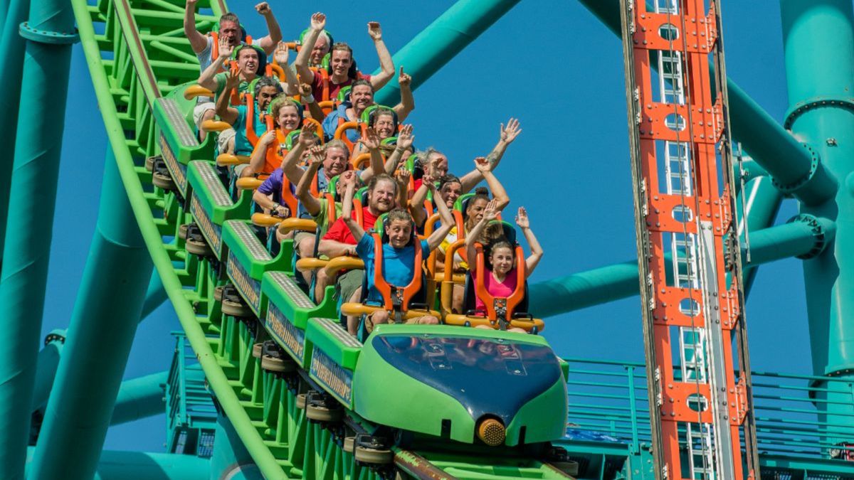 A car of passengers on Kingda Ka lift their hands up as they ride by.