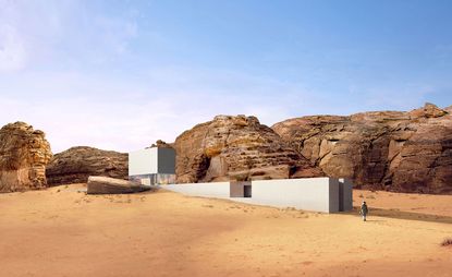 A render showing a white minimalist structure in the desert with rocks in the background