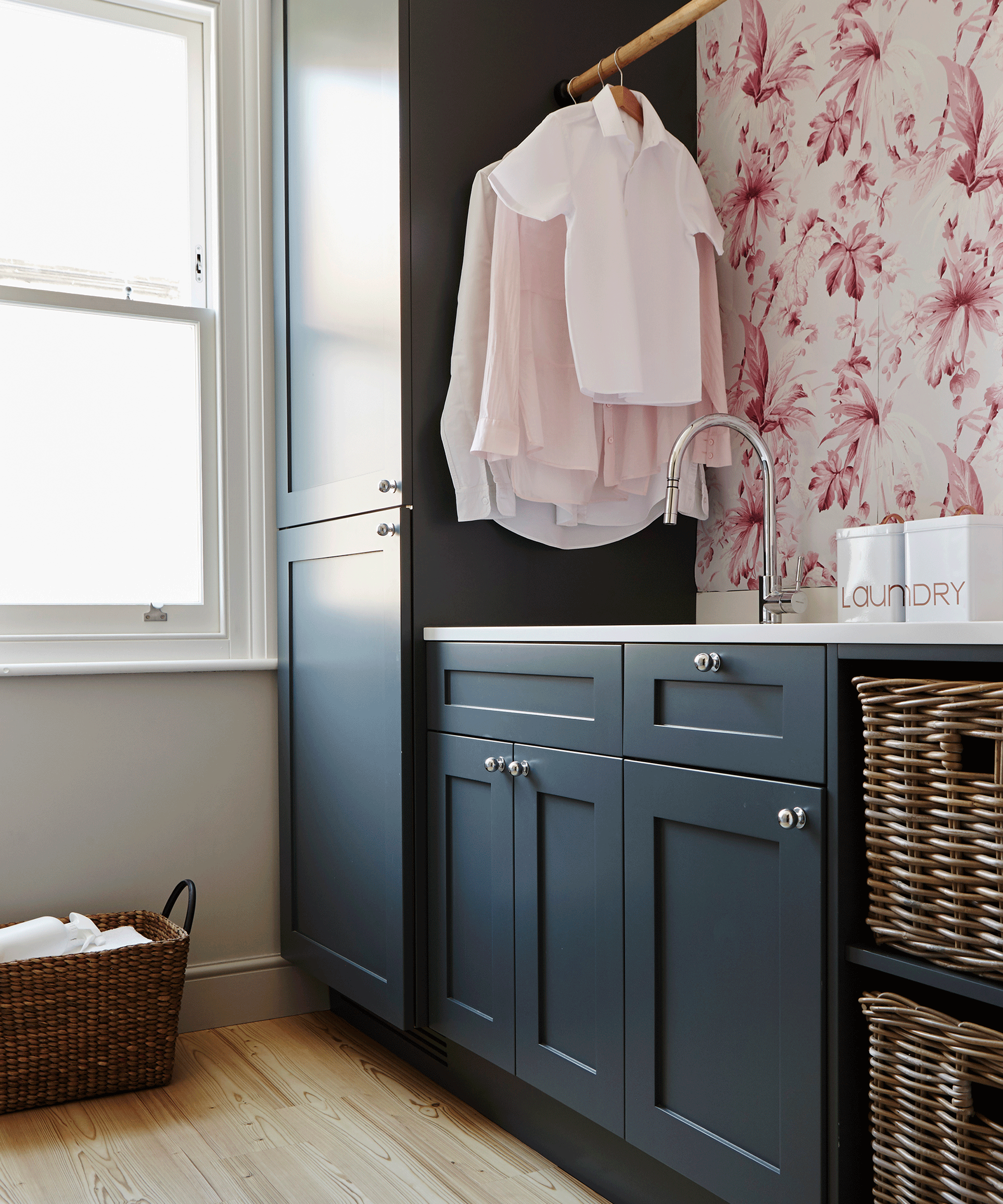 laundry room with shirts hanging