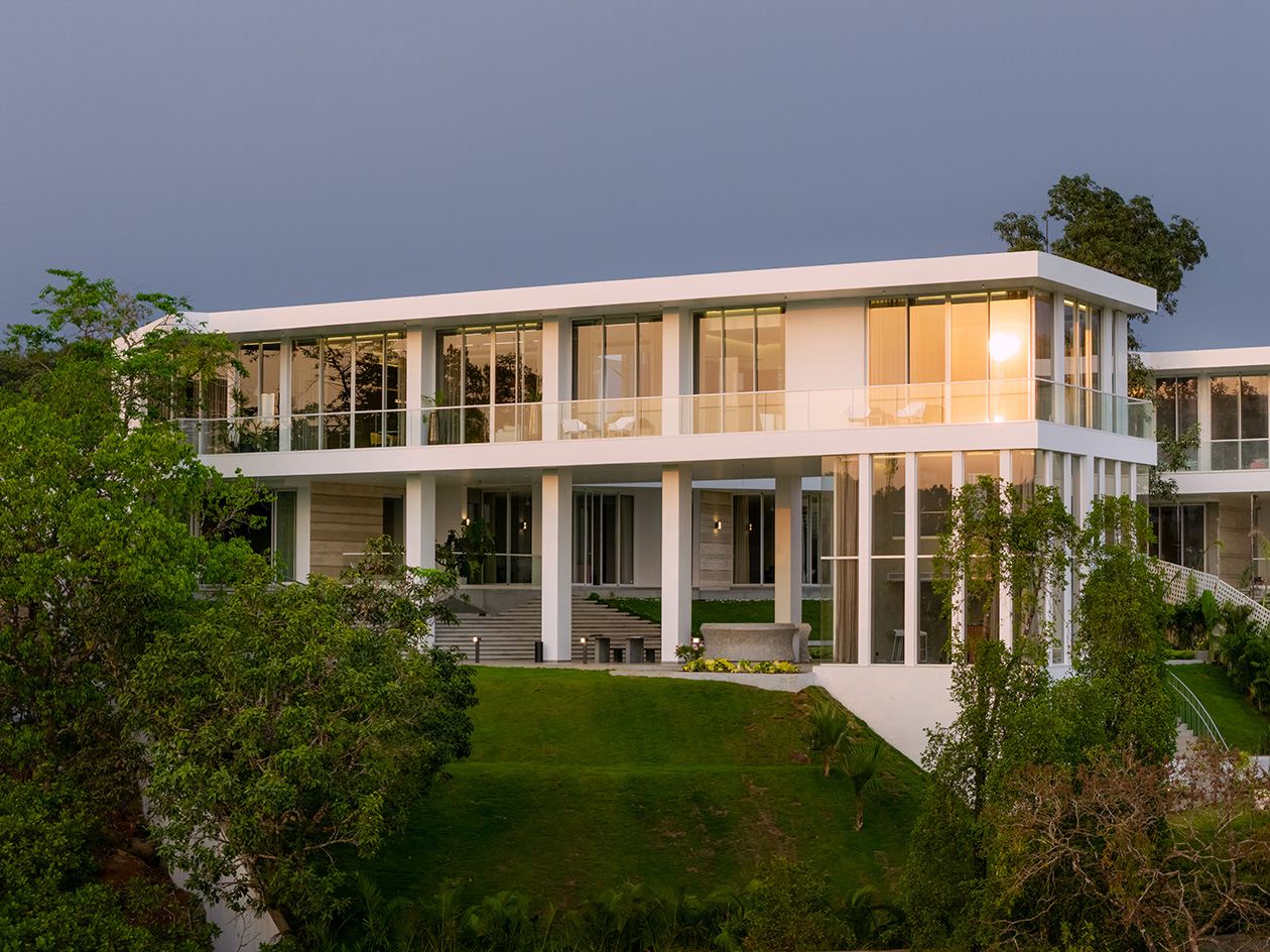 a white Goa villa in the leafy indian forest