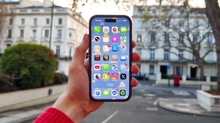 An iPhone 17 Pro being held in the hand outside